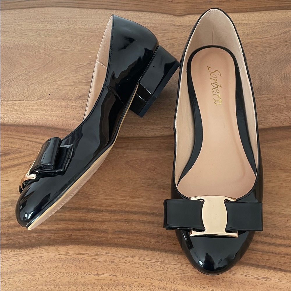 8.    Luxurious Black Patent Leather Loafers with Gold Accent